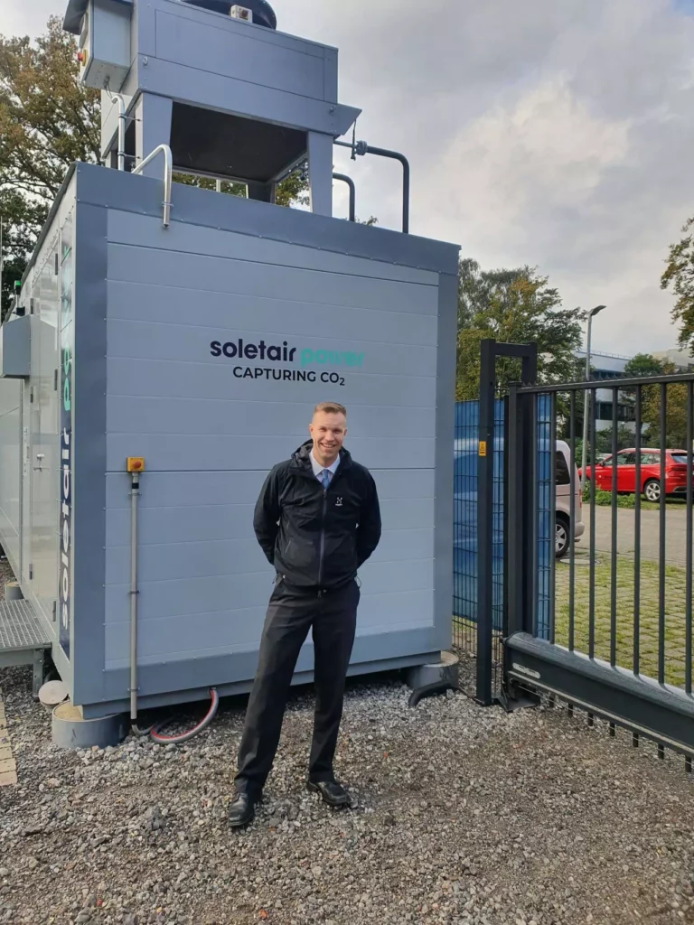 Man standing in front of a machine